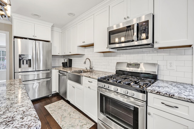 131 Long Hill Cross Rd, Shelton, CT 06484 - kitchen featuring stainless steel appliances, white cabinets, dark wood-style floors, tasteful backsplash, and recessed lighting