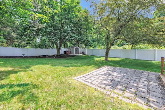 131 Long Hill Cross Rd, Shelton, CT 06484 - fenced backyard with a storage shed and a patio