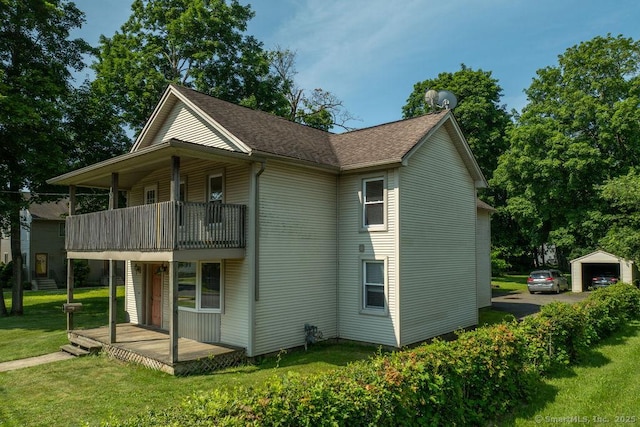 23 Church St, Plainville, CT 06062 - rear view of property with a balcony and a yard