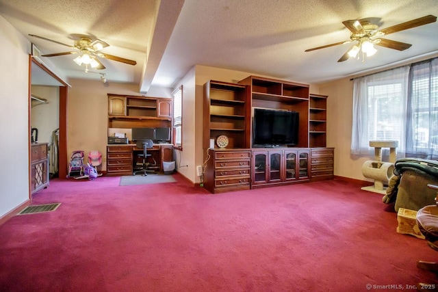 23 Church St, Plainville, CT 06062 - living room with a ceiling fan, an office area, dark colored carpet, and a textured ceiling