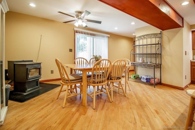 23 Church St, Plainville, CT 06062 - dining area featuring a wood stove, a ceiling fan, light wood-style flooring, and recessed lighting