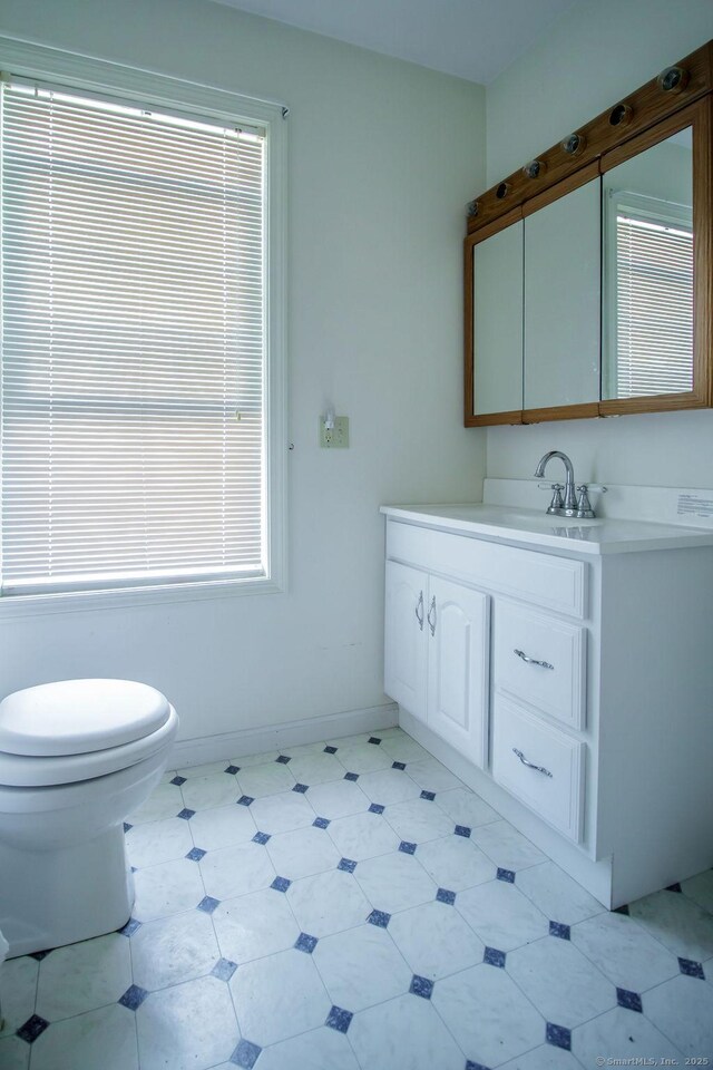23 Church St, Plainville, CT 06062 - bathroom with vanity and tile patterned floors