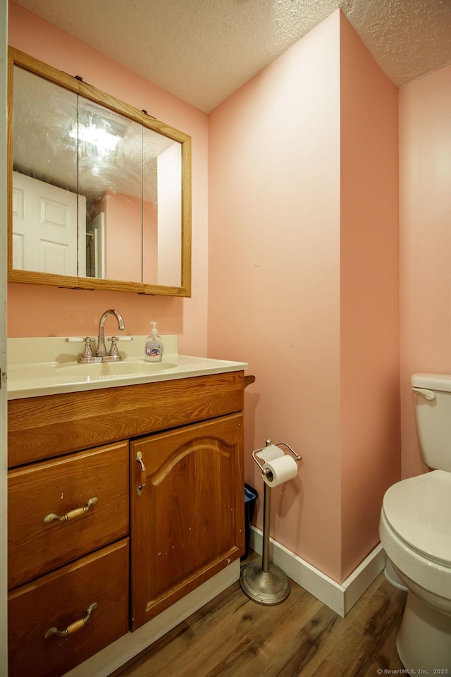 23 Church St, Plainville, CT 06062 - bathroom with a textured ceiling, wood finished floors, and vanity