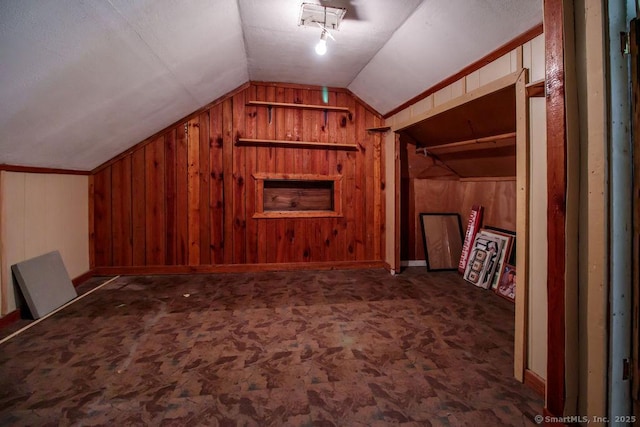 23 Church St, Plainville, CT 06062 - bonus room with vaulted ceiling, wood walls, and carpet