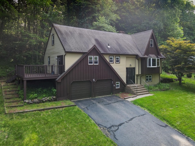 166 S Main St, Marlborough, CT 06447 - view of front of home with driveway, board and batten siding, a front lawn, a garage, and a shingled roof