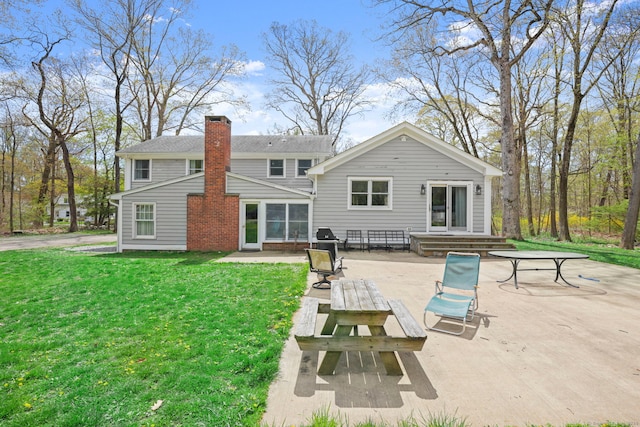 24 Appletree Ln, Norwalk, CT 06850 - rear view of house featuring a patio area, a yard, and a chimney