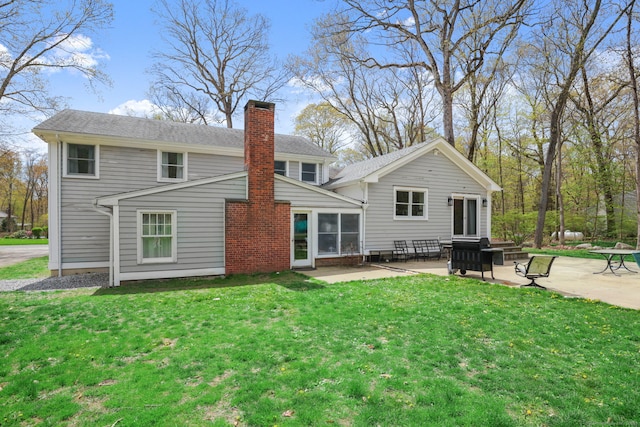24 Appletree Ln, Norwalk, CT 06850 - rear view of house with a patio area, a chimney, and a yard