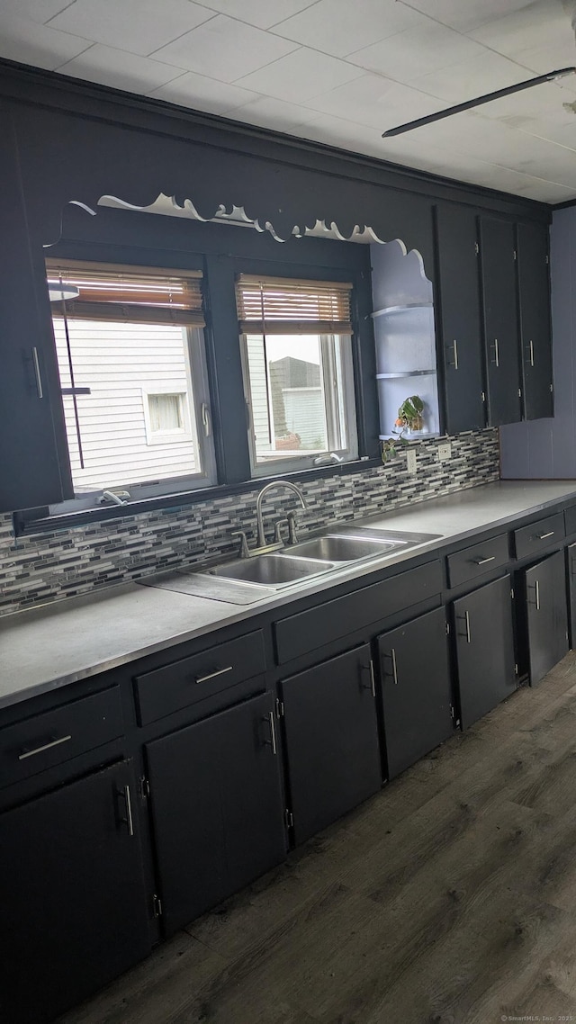 44 Convent Ave, Norwich, CT 06360 - kitchen with decorative backsplash, dark wood-type flooring, crown molding, and light countertops