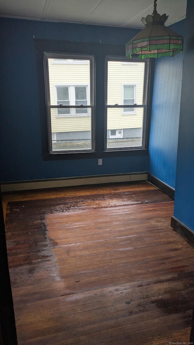 44 Convent Ave, Norwich, CT 06360 - spare room with baseboards and dark wood-style floors