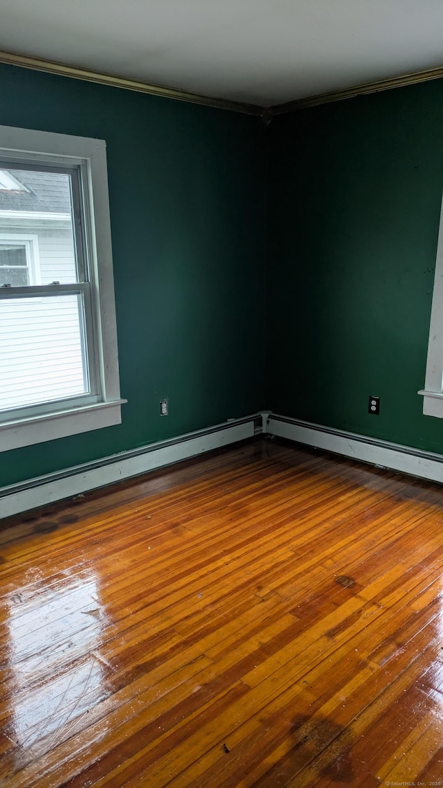 44 Convent Ave, Norwich, CT 06360 - empty room featuring dark wood-style floors and ornamental molding