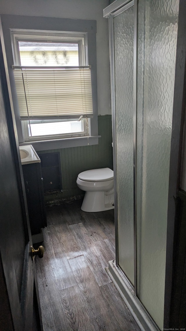 44 Convent Ave, Norwich, CT 06360 - full bath featuring a wainscoted wall, vanity, a stall shower, plenty of natural light, and wood finished floors