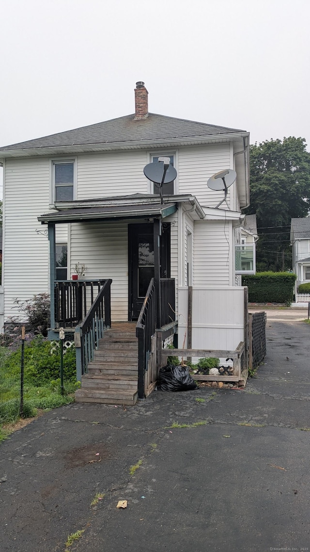 44 Convent Ave, Norwich, CT 06360 - view of front of property featuring a chimney and a porch
