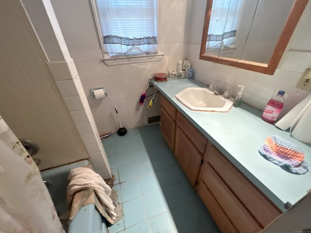 29 Tree Hill Rd, Waterbury, CT 06708 - bathroom with tile walls, vanity, and a wainscoted wall