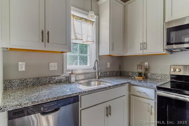 41 Eden Ave Unit 3, Southington, CT 06489 - kitchen with appliances with stainless steel finishes, light stone counters, and white cabinets