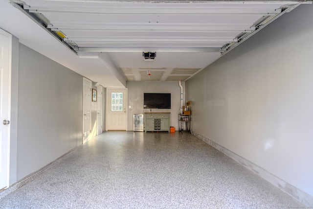 41 Eden Ave Unit 3, Southington, CT 06489 - garage featuring a garage door opener and baseboards