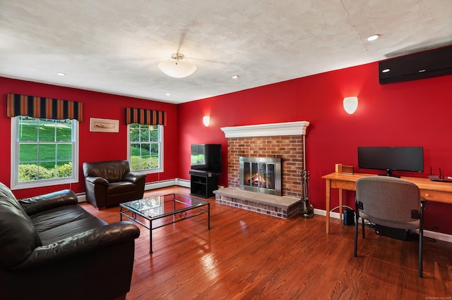 35 Cedar Vale Dr, New Milford, CT 06776 - living area with wood finished floors, baseboard heating, recessed lighting, a brick fireplace, and an office area