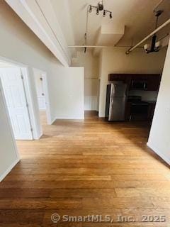 850 Grand Ave, New Haven, CT 06511 - unfurnished living room with wood finished floors and a chandelier