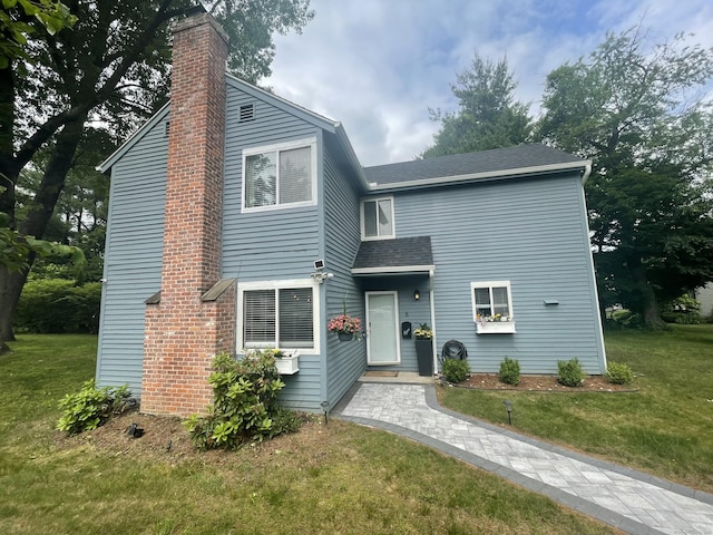 6 Mathers Xing Unit 6, Simsbury, CT 06070 - view of front of home featuring a chimney, a front lawn, and a shingled roof