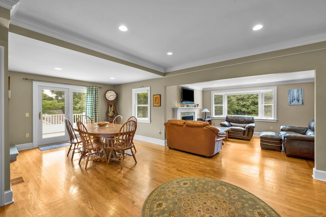 128 Holcomb Hill Rd, New Hartford, CT 06057 - dining area with healthy amount of natural light, light wood-style floors, a premium fireplace, crown molding, and recessed lighting