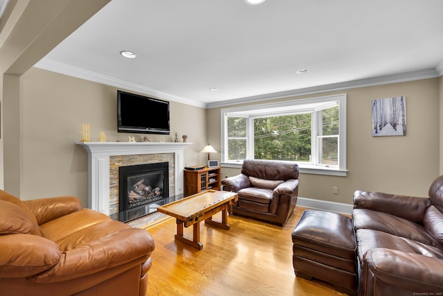 128 Holcomb Hill Rd, New Hartford, CT 06057 - living area featuring light wood-style floors, ornamental molding, a fireplace with flush hearth, and recessed lighting