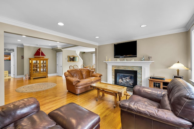 128 Holcomb Hill Rd, New Hartford, CT 06057 - living area featuring light wood finished floors, recessed lighting, ornamental molding, and a glass covered fireplace