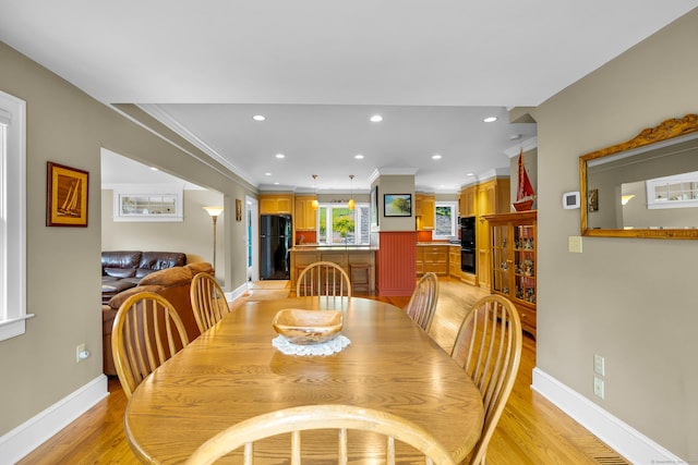 128 Holcomb Hill Rd, New Hartford, CT 06057 - dining area featuring light wood-type flooring, crown molding, and recessed lighting