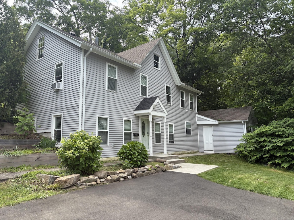 24 Main St, East Hampton, CT 06424 - view of front of house with cooling unit and roof with shingles