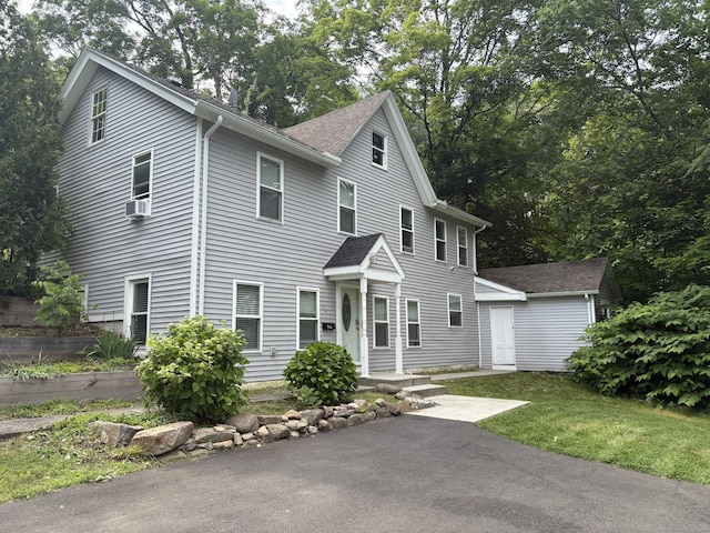 24 Main St, East Hampton, CT 06424 - view of front of house with cooling unit and roof with shingles