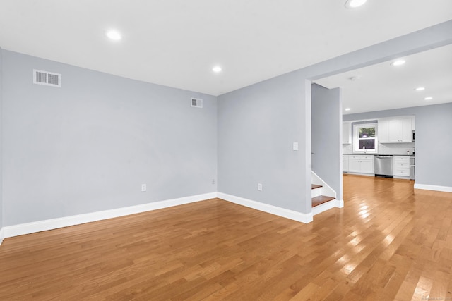 24 Main St, East Hampton, CT 06424 - spare room featuring light wood-type flooring, stairs, and recessed lighting