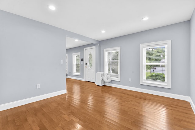 24 Main St, East Hampton, CT 06424 - unfurnished living room featuring light wood-type flooring and recessed lighting