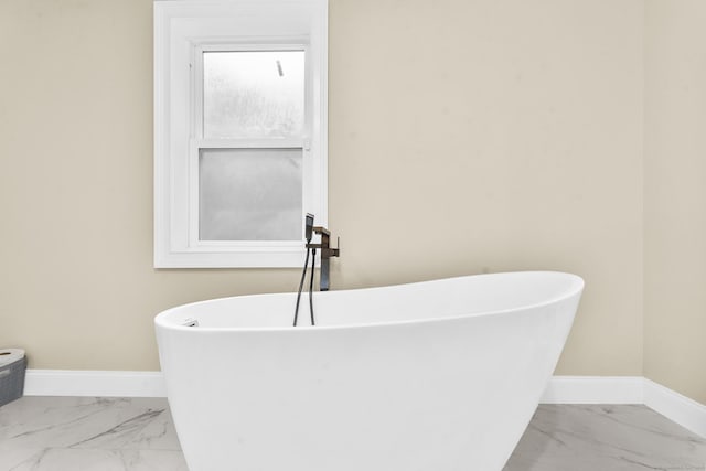 24 Main St, East Hampton, CT 06424 - bathroom with marble finish flooring and a freestanding tub