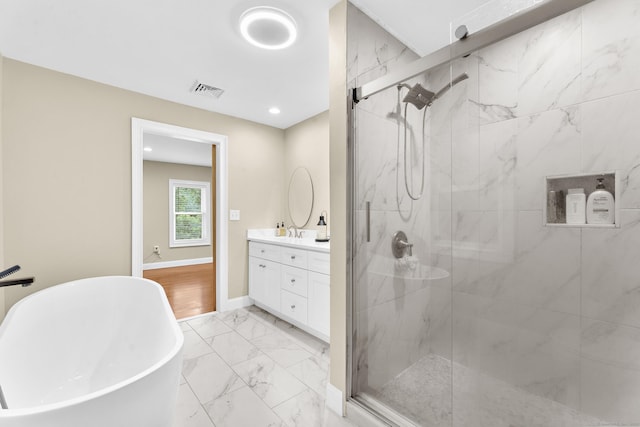 24 Main St, East Hampton, CT 06424 - full bathroom with marble finish flooring, a marble finish shower, vanity, a soaking tub, and recessed lighting