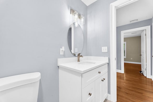 24 Main St, East Hampton, CT 06424 - bathroom featuring vanity and wood finished floors