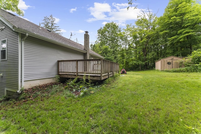 24 Main St, East Hampton, CT 06424 - view of grassy yard featuring a storage shed and a deck
