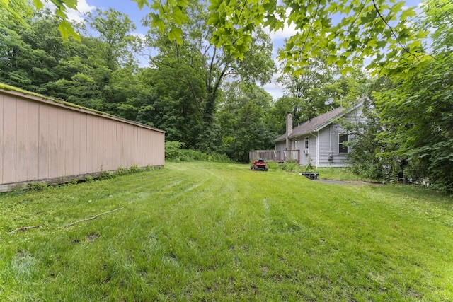 24 Main St, East Hampton, CT 06424 - view of green lawn with a deck