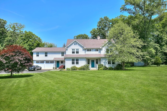 16 Gault Park Dr, Westport, CT 06880 - view of front of property featuring an attached garage, a front lawn, driveway, a shingled roof, and a chimney