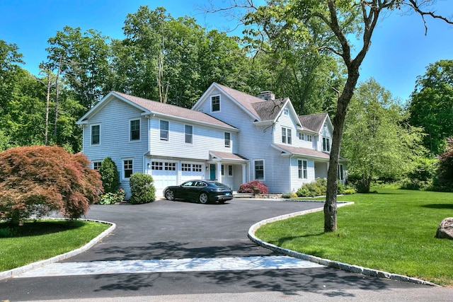 16 Gault Park Dr, Westport, CT 06880 - shingle-style home featuring asphalt driveway, a shingled roof, a front yard, and a garage
