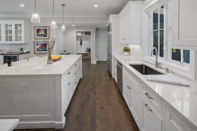 16 Gault Park Dr, Westport, CT 06880 - kitchen with white cabinets, a kitchen island, dark wood finished floors, stainless steel appliances, and wine cooler