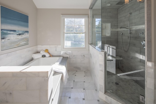 16 Gault Park Dr, Westport, CT 06880 - bathroom with plenty of natural light, a garden tub, tile walls, a stall shower, and a wainscoted wall