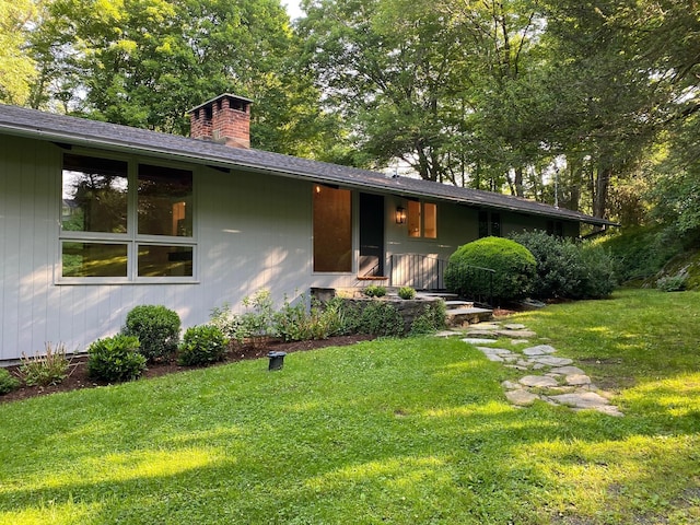 60 Ferry Bridge Rd, Washington, CT 06793 - view of front facade featuring a chimney and a front yard