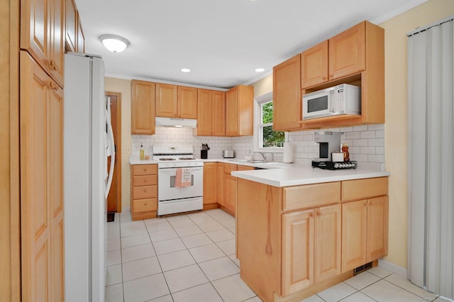 606 Forest St, East Hartford, CT 06118 - kitchen featuring white appliances, under cabinet range hood, a peninsula, light brown cabinets, and light tile patterned floors