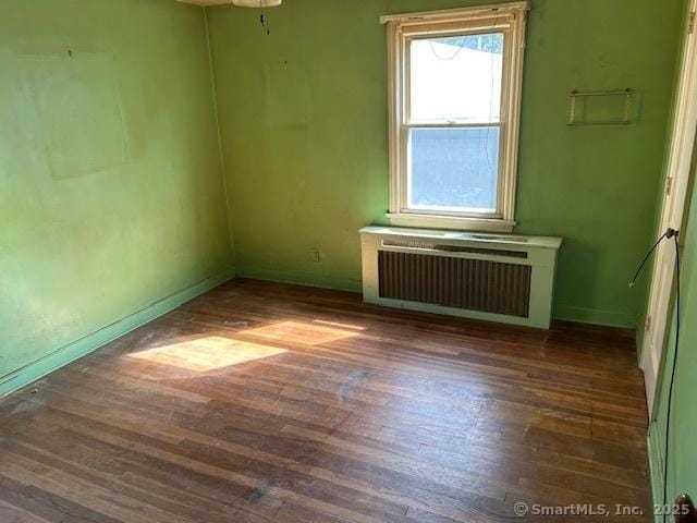 276 Spencer St, Naugatuck, CT 06770 - spare room with radiator and wood finished floors