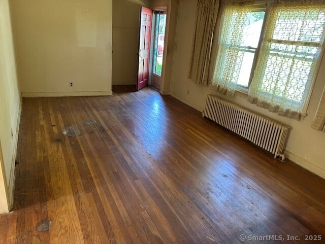 276 Spencer St, Naugatuck, CT 06770 - unfurnished room with radiator, wood finished floors, and healthy amount of natural light