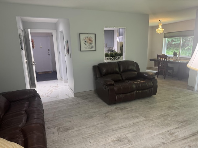 37 Brookwood Dr Apt D, Rocky Hill, CT 06067 - living room with light wood-style floors and a chandelier