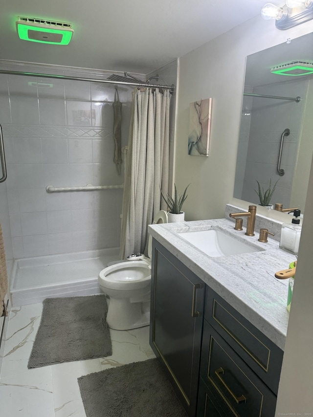 37 Brookwood Dr Apt D, Rocky Hill, CT 06067 - bathroom featuring marble finish flooring, a stall shower, and vanity
