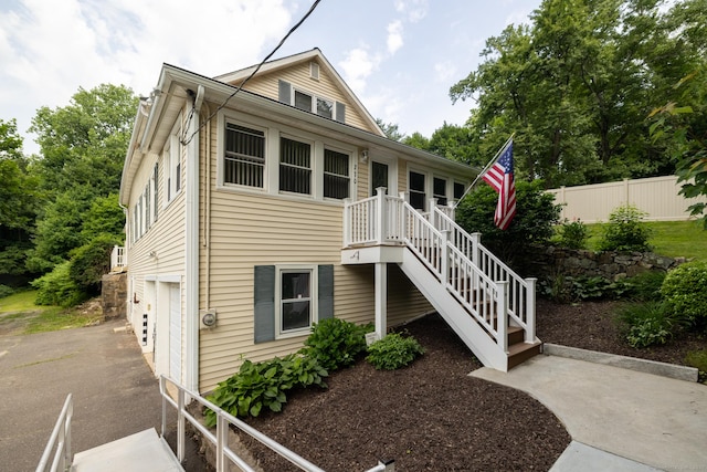270 Decicco Rd, Waterbury, CT 06705 - view of front of home with stairs, a garage, and driveway