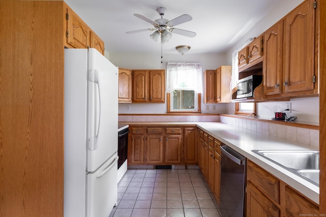 270 Decicco Rd, Waterbury, CT 06705 - kitchen with stainless steel appliances, light countertops, brown cabinetry, a ceiling fan, and light tile patterned flooring