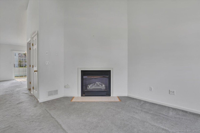 46 Rolling Grn, Middletown, CT 06457 - unfurnished living room featuring carpet flooring and a fireplace with flush hearth