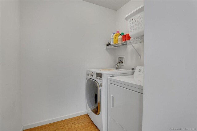 46 Rolling Grn, Middletown, CT 06457 - laundry room featuring washer and clothes dryer and light wood-style flooring