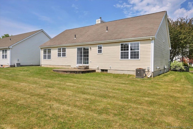 46 Rolling Grn, Middletown, CT 06457 - rear view of property with a chimney, a lawn, and a patio